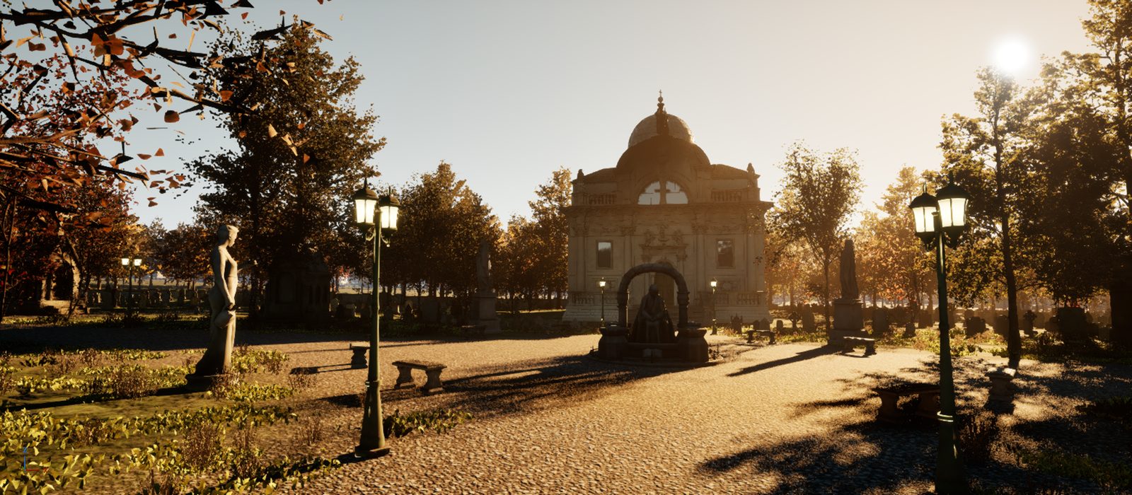 Cemetery park with a domed chapel, lanterns and a gravel avenue