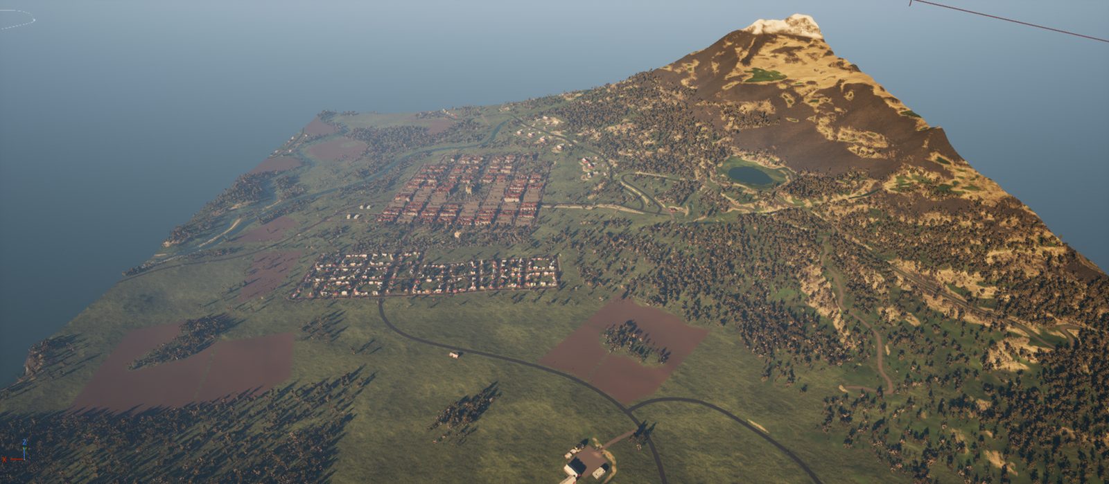 Aerial view of the 2.5 km demo square with the town, farms and a mountain